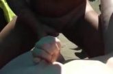 Oma op naaktstrand onder sperma bedolven